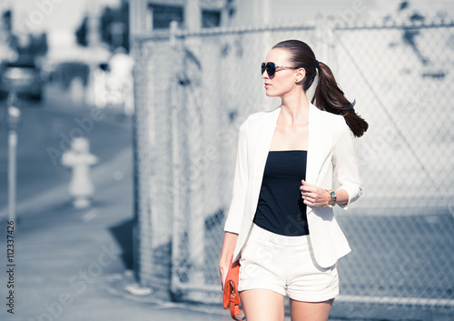 High fashion model walking down the street.     © kieferpix