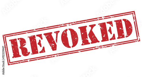 revoked red stamp on white background photo