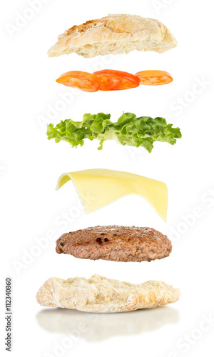  floating sandwich, burger sandwich with hamburger, cheese, lettuce and tomato