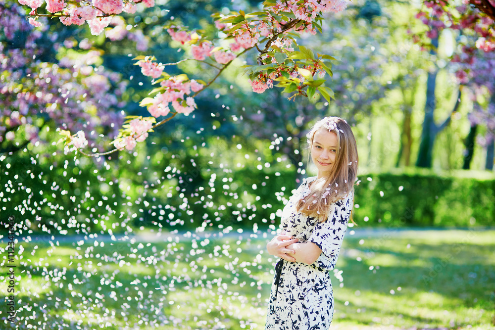 Beautiful young woman in blooming spring park Beautiful young woman in blooming spring park