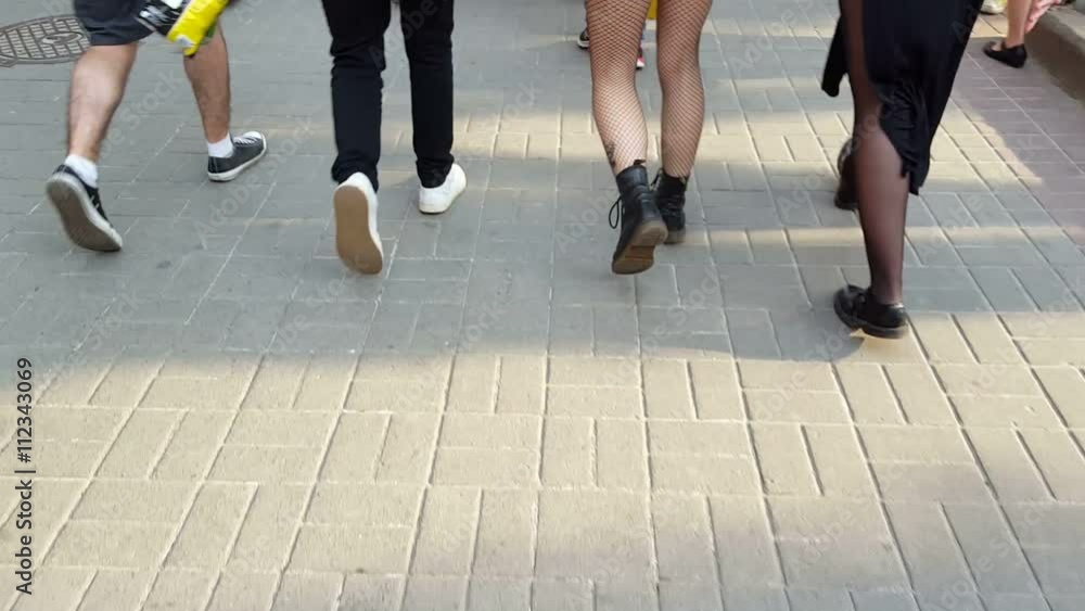 Hipsters walking down the street Hipsters walking down the street