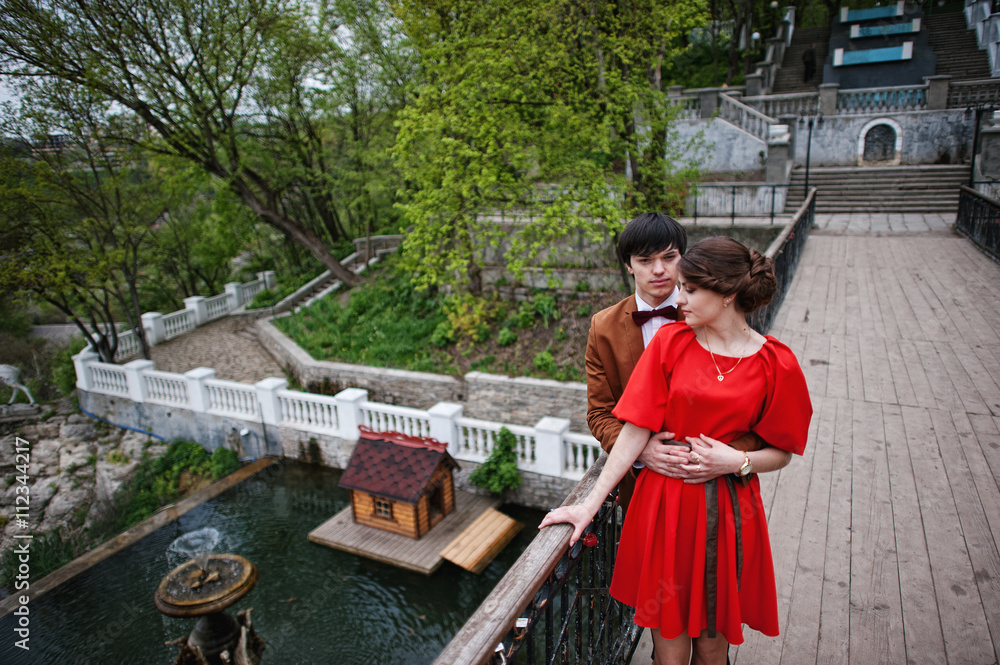 Couple hugging in love background bridge of river with fountain. Couple hugging in love background bridge of river with fountain.
