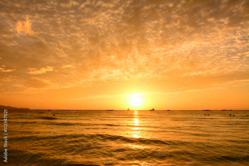 The scenic sunset from the beach of Boracay island, Philippines