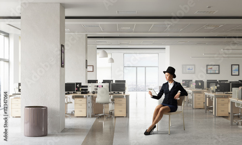 Businesswoman on chair in office