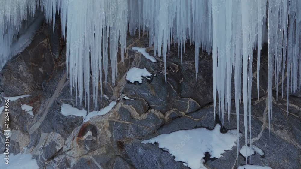 Huge icicles on rocks. Huge icicles on rocks.