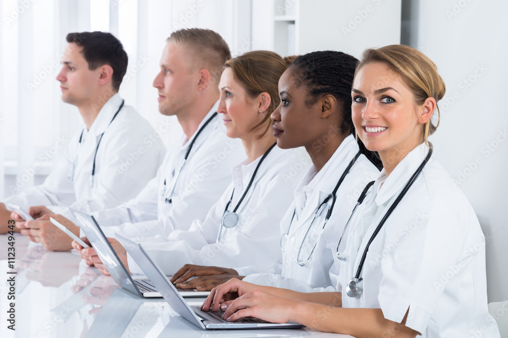 Female Doctor Working With Her Colleagues Female Doctor Working With Her Colleagues
