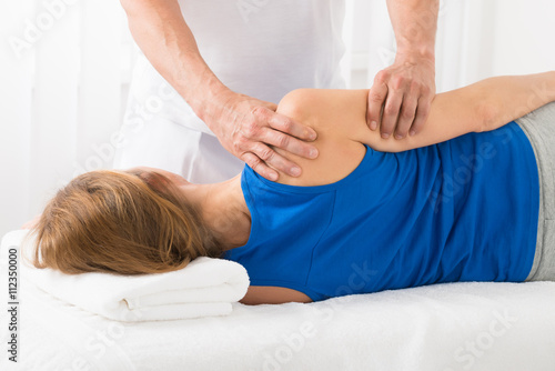 Masseur Doing Arm Massage In Spa