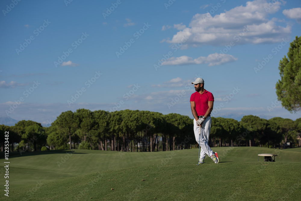 handsome middle eastern golf player portrait at course
