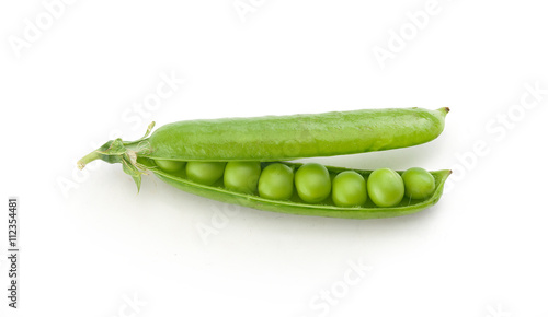 Fresh green pea pod on the white