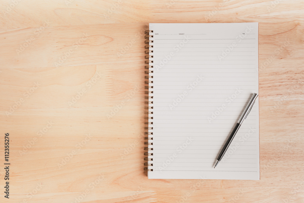 a pen and blank paper of open book a pen and blank paper of open book