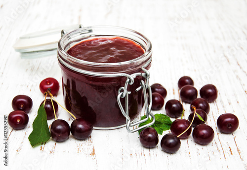Cherry jam with fresh berries