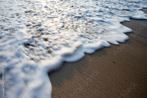 blurred foam and beach