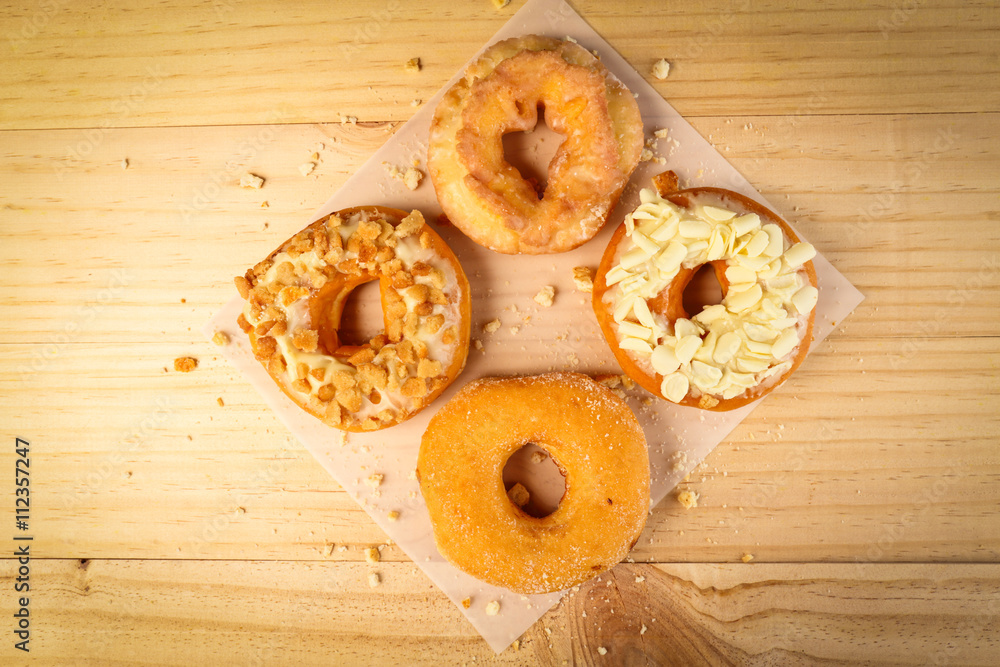 Donuts on wooden background