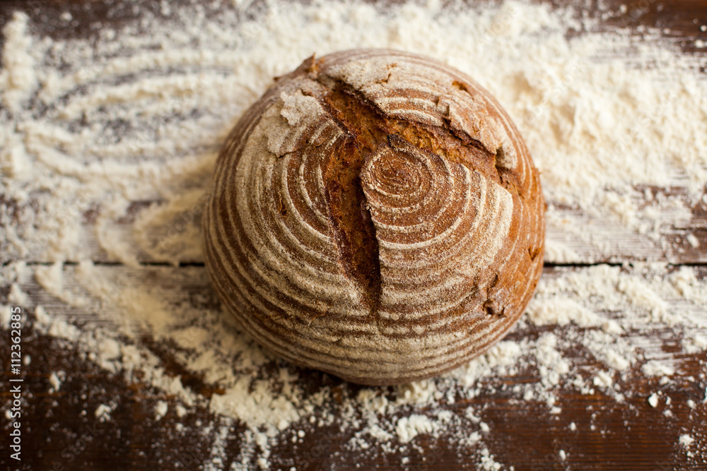 Bread and flour on the table Bread and flour on the table