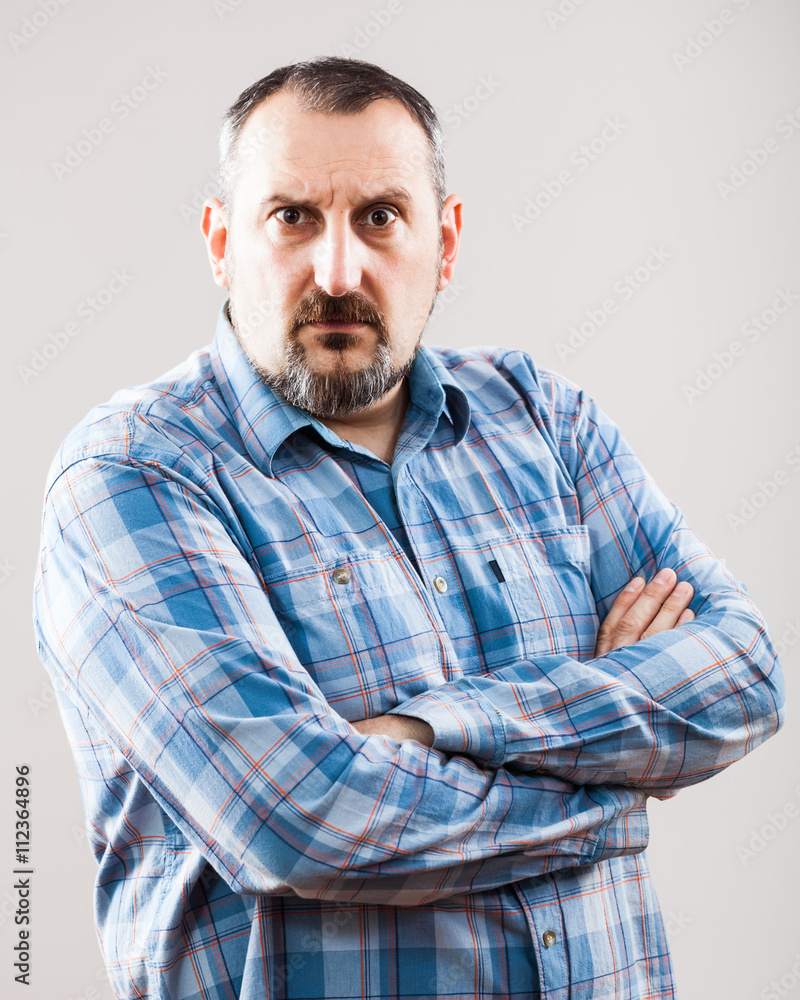 Studio shot portrait of surprised and worried man Studio shot portrait of surprised and worried man