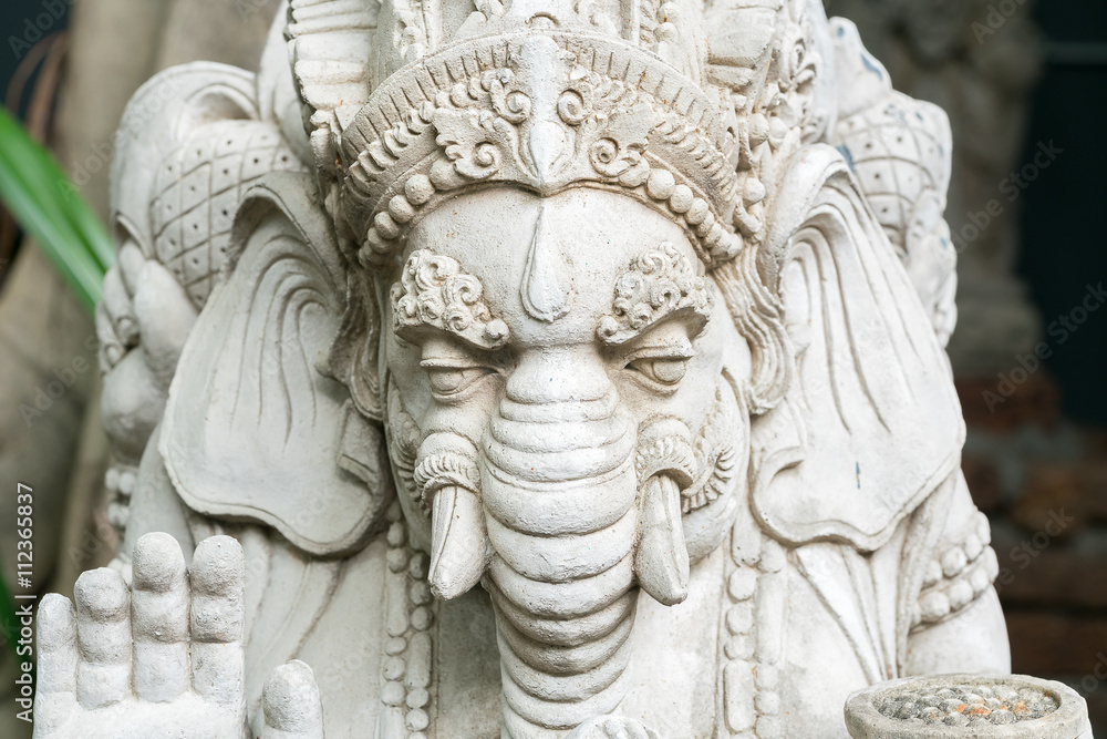 Old stone statue of Ganesha - a hindu symbol of luck in the jungle Old stone statue of Ganesha - a hindu symbol of luck in the jungle