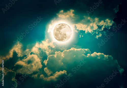 Nighttime sky with clouds, bright full moon would make a great background. © kdshutterman