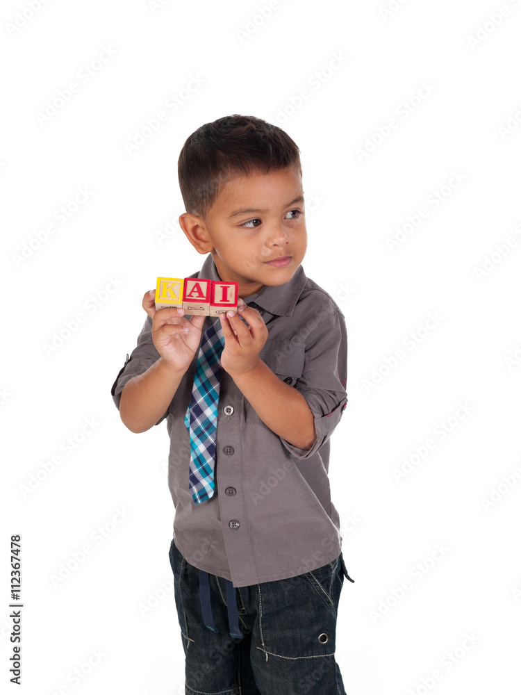 cute little boy showing his name on building blocks. cute little boy showing his name on building blocks.