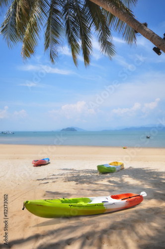Fototapeta Naklejka Na Ścianę i Meble -  Kayak boat on tropical beach background, happy summer holiday concept