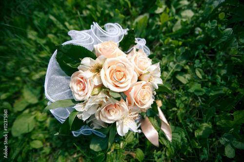 Wedding bouquet from peach-colored roses