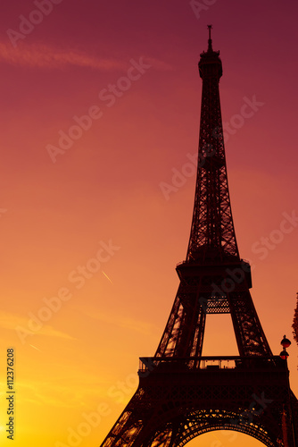 Eiffel Tower silhouette at sunset in Paris France