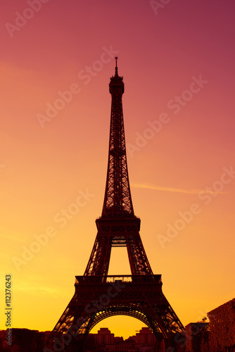 Eiffel Tower silhouette at evening sunset light in Paris France © nevodka.com