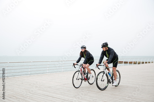 Couple riding on bicycle