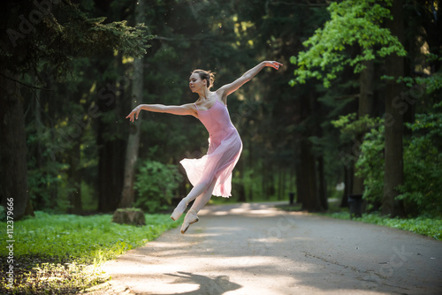 Ballerina in jump in the park