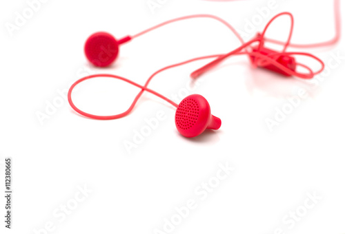red earphones on white background isolated with path