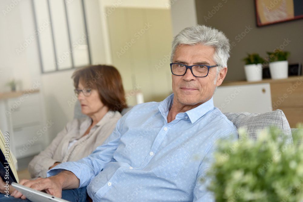 Senior people relaxing in couch at home Senior people relaxing in couch at home
