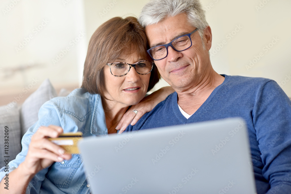 Senior couple shopping on internet Senior couple shopping on internet