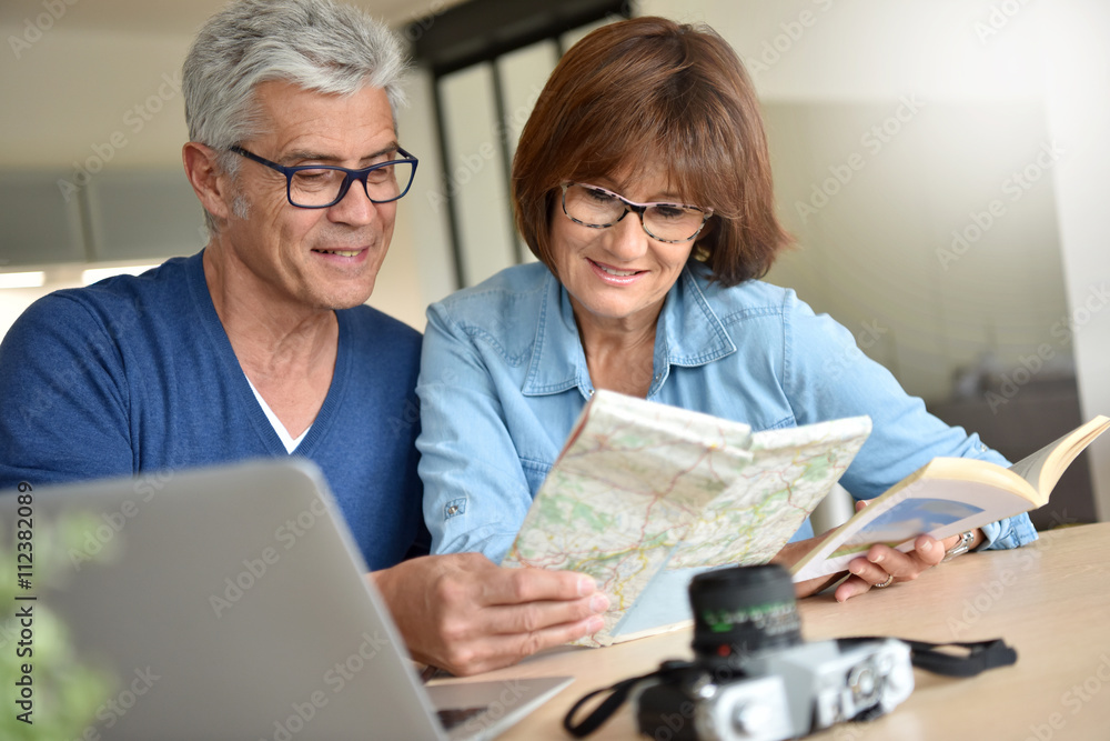 Senior couple preparing vacation trip