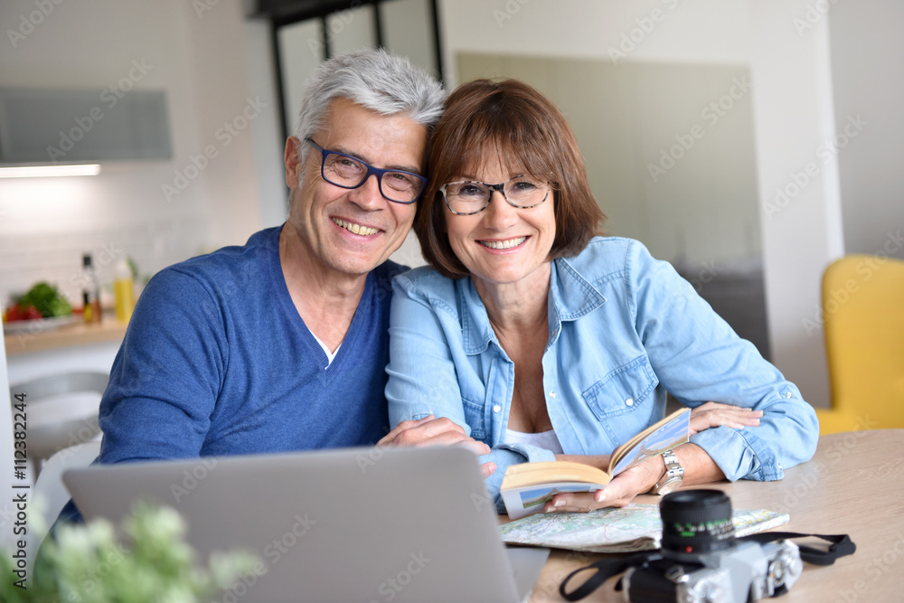 Senior couple preparing vacation trip Senior couple preparing vacation trip