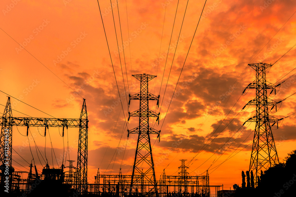 high voltage substation on sunset background  
