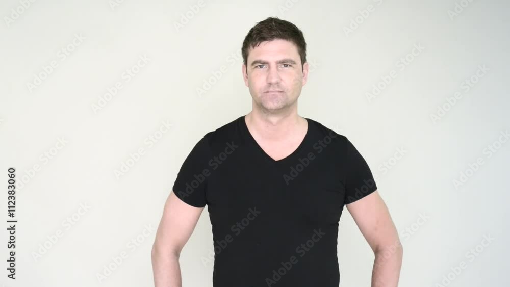 Serious man in casual dress looking away sideways and at camera. Serious man in casual dress looking away sideways and at camera.