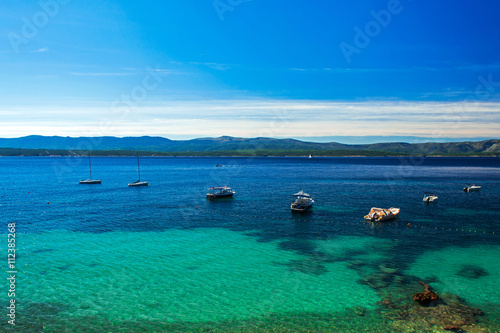 beautiful sea view on crystal water bay with yachts and boats on island Brac, Croatia