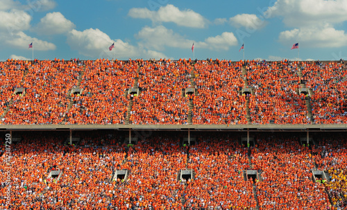 Crowd of thousands dressed in orange