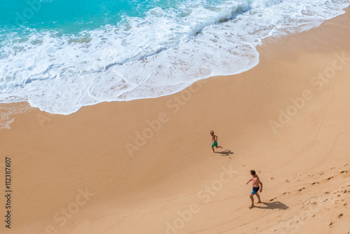 Family at beautiful beach Carvalho of Algarve, Portugal