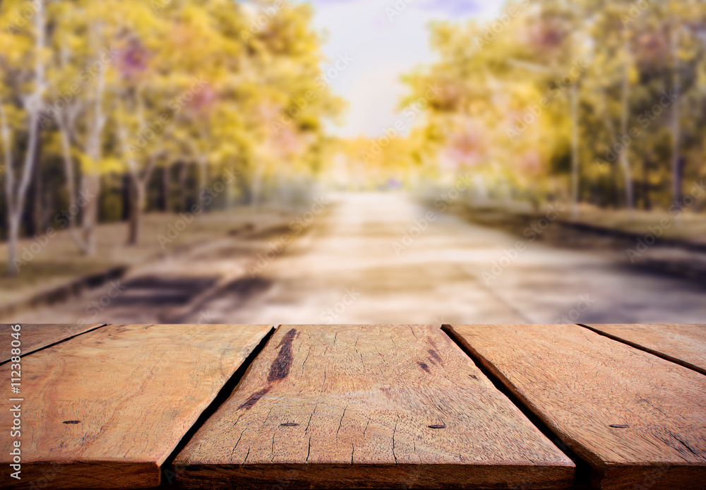 rustic table and road in the forest. rustic table and road in the forest.