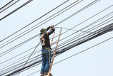 Electrician works in the height