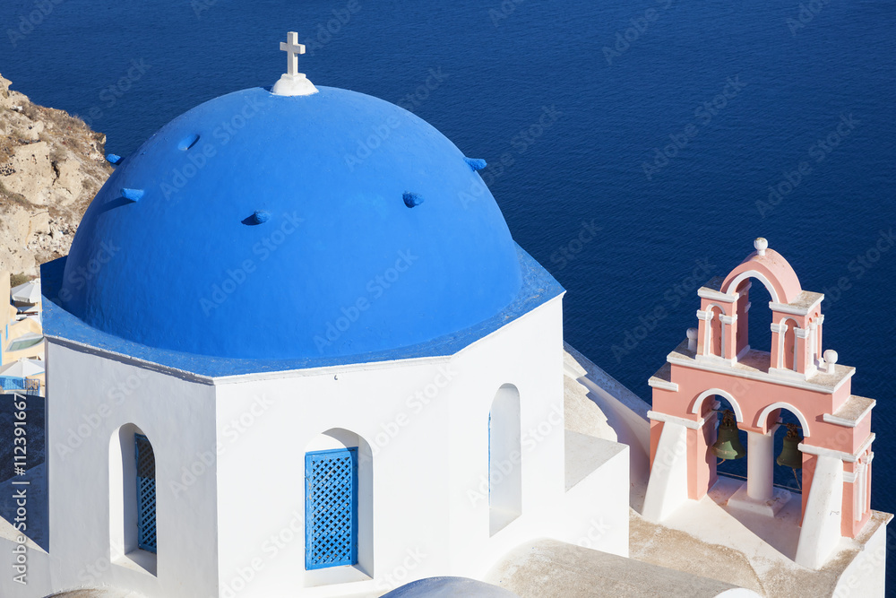 Traditional architecture church in Oia village, landmark of Gree
