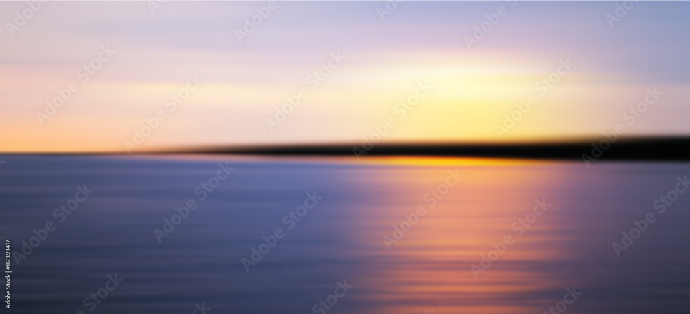 Colorful sunset over sea coast. Blurred photo