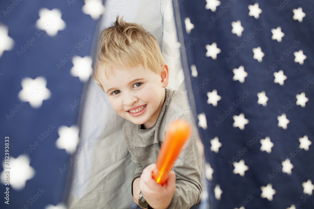 Boy Playing With Toy Sword Inside Tent At Home Boy Playing With Toy Sword Inside Tent At Home