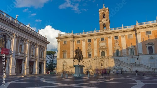 Capitoline hill landmark square timelapse hyperlapse surrounded by neo classic museums buildings with clock tower and bronze statue of Mark Aurelius photo