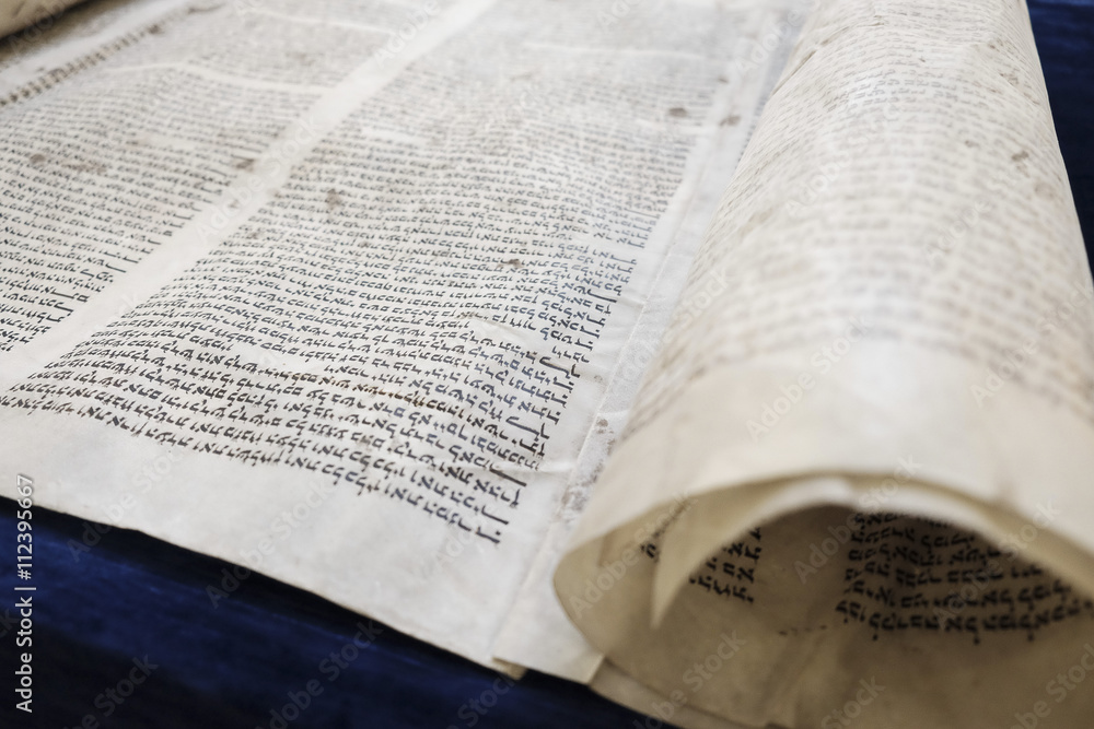 Fototapeta premium Torah on a dark-blue table.