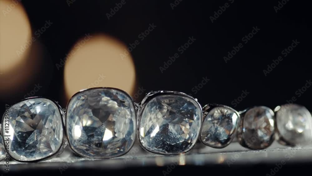 Diamond necklace with large stones falling on the table Diamond necklace with large stones falling on the table