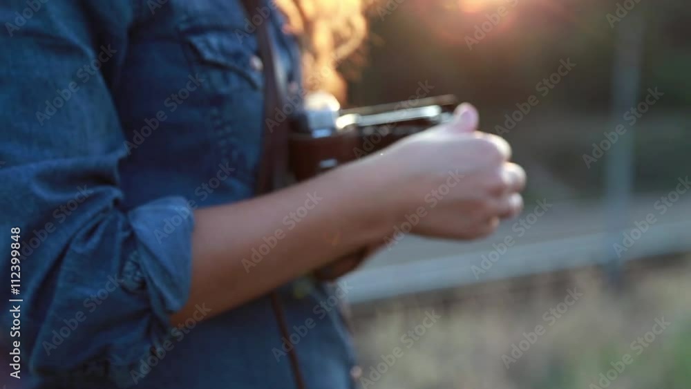 Woman Enjoys a Retro Camera Woman Enjoys a Retro Camera