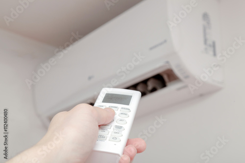 Using air conditioner, remote close up