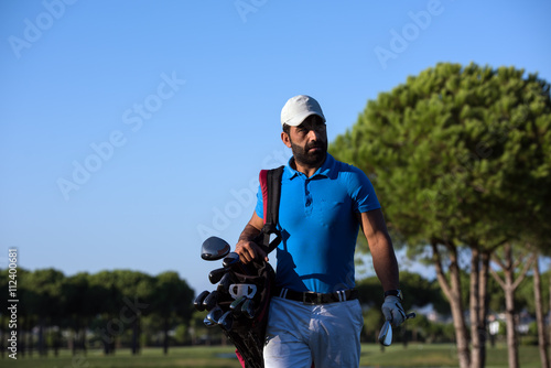 golfer  walking and carrying bag © .shock