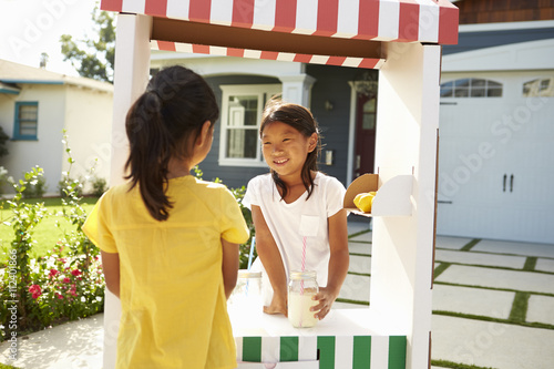 Two Girls At Home Made Lemonade Stall